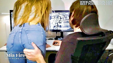 Blonde in tight blue jeans shows juicy ass bending over man at computer watching CCTV footage