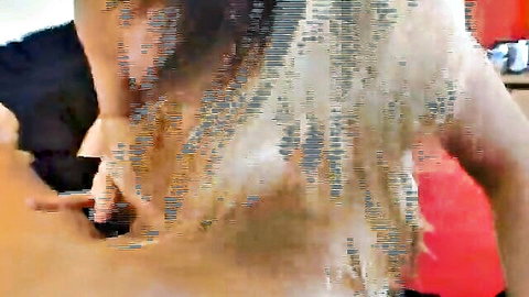 Blonde woman with long hair bent over getting fucked from behind
