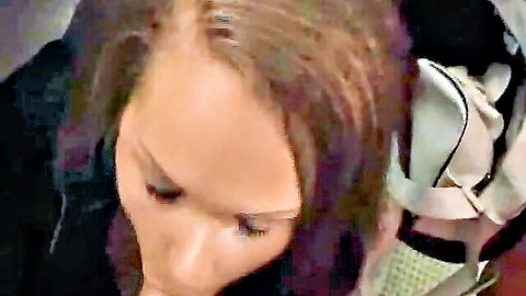 Brunette woman with intense expression in car seatbelt, squirting guarantee close-up