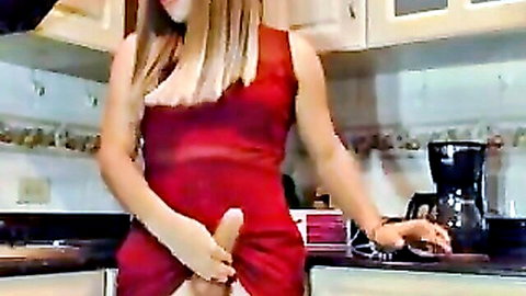 T-girl in red dress wanking schlong in kitchen with friend