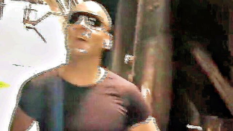 Bald muscular man in sunglasses for brunette messy facial scene