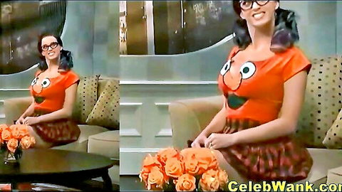 Katy Perry in sexy Elmo cosplay, large breasts, orange top and skirt