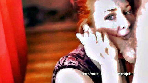 Camille Crimson redhead giving intense blowjob close-up