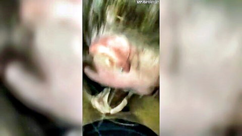 Blurry ebony woman slurping massive BBC cock in intense deepthroat blowjob