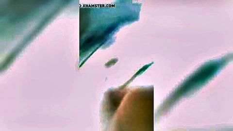 Blurry green-tinted abstract Korean straight porn frame with xhamster watermarks