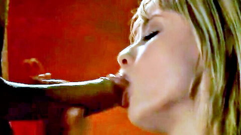Pretty blonde domina giving oral sex to black cock close-up