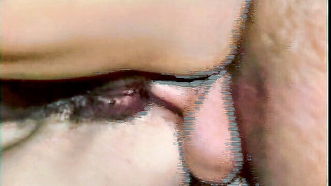 Close-up of seductive woman's intense eye with heavy dark makeup