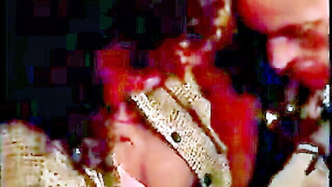 Vintage 1994 porn close-up of curly-haired woman in intimate scene