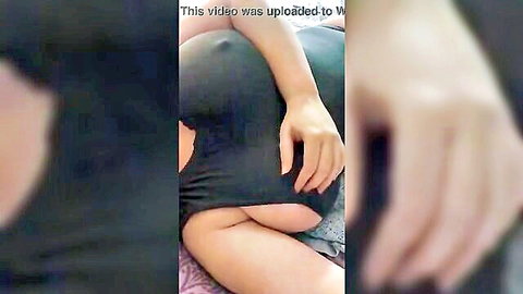 Woman in see-through black shirt exposing breasts and ass from behind