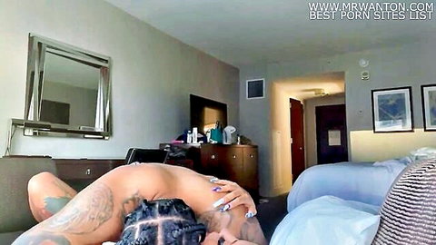 Ebony beauty with braids and tattoos poses nude on bed, teasing for intense orgasm