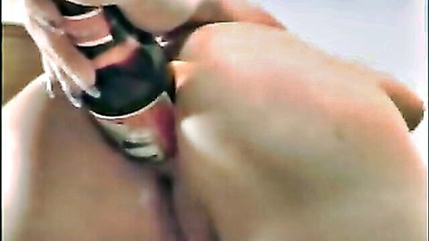 Curvy woman inserting beer bottle in ass, solo amateur insertion