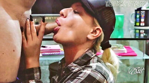 Blonde babe in trucker hat and plaid shirt sucking thick cock with tongue out in kitchen blowjob