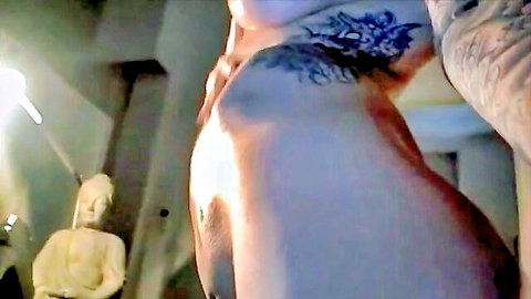 Tattooed Mila poses nude, showcasing curves and ink