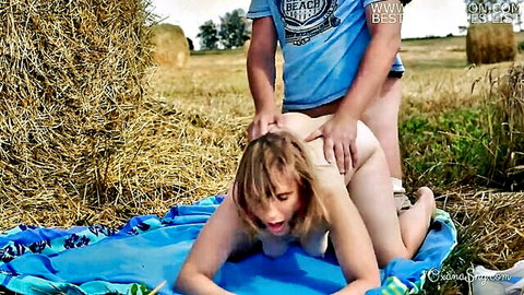 Blonde woman in outdoor doggy style hardcore sex on blanket in field