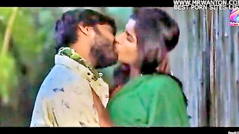 Desi Indian couple kissing passionately in village outdoors