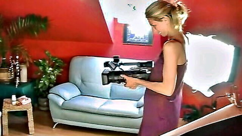 Blonde amateur in purple dress holding camera for homemade porn
