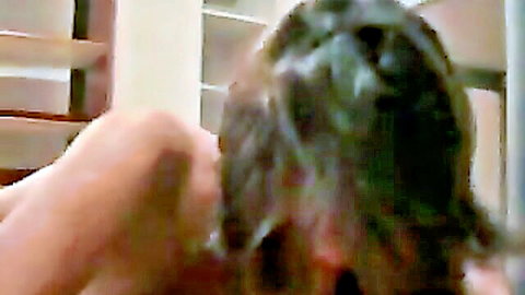 Brunette woman eagerly sucking cock in intense close-up blowjob