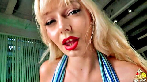 Busty blonde Jessica Starling teasing with cleavage in striped top