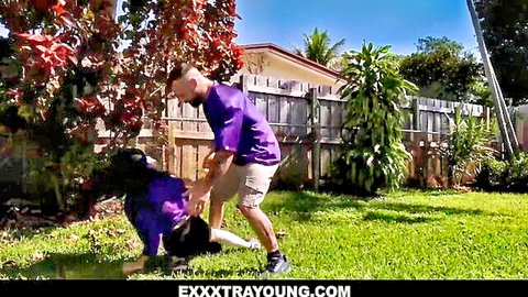 Freya Von Doom tackled by Sergeant Miles in playful outdoor rough play