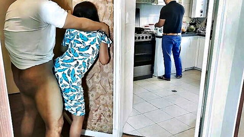 Muscular bull grabs petite Asian wife's big ass in dress pants down while clueless husband cooks
