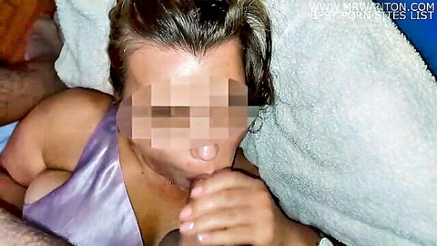 Close-up of brunette woman giving slow blowjob with cum in mouth and facial
