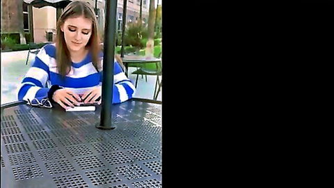 Melody Marks as hot nursing student reading outdoors in striped sweater