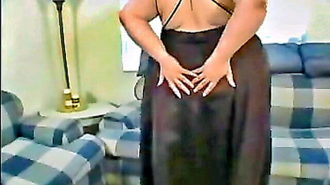 Curvy BBW babe in black dress, hands on hips rear view - Scale Busting Babes 8