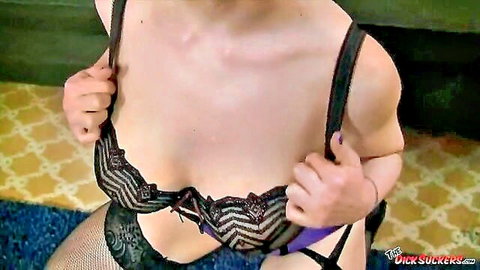 Larkin Love in black lace bra and stockings, teasing cleavage
