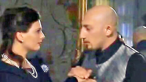 Intense close-up of brunette woman and bald man in formal attire, Italian brothel drama