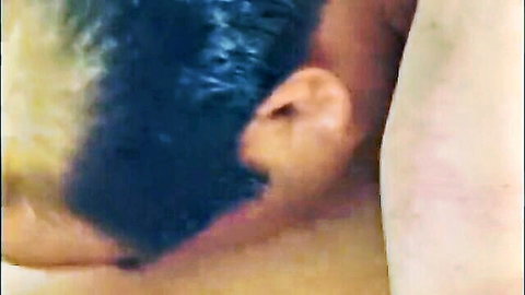 Close-up of mature man with blonde-highlighted dark hair