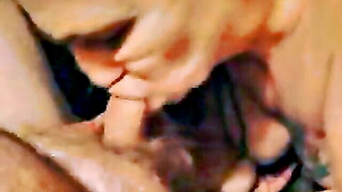 Blonde woman sucks thick cock deep in mouth with hand gripping shaft closeup blowjob.