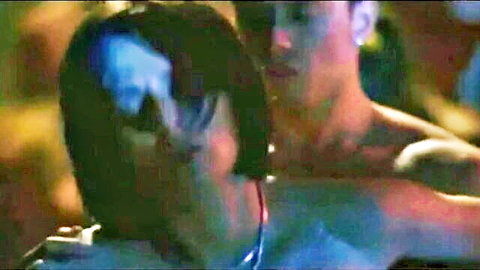 Close-up of Asian woman with black hair embraced by shirtless man in intimate swinging scene