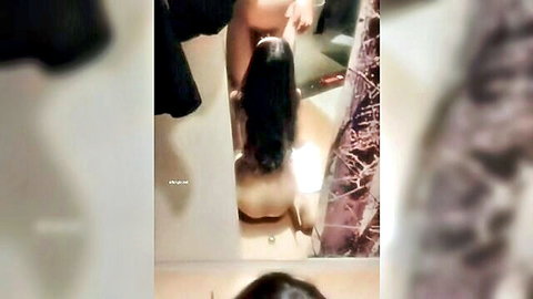Asian woman with long black hair in dazed seductive pose, exposed curves