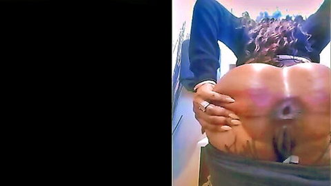 Ebony woman spreading big ass to expose rectal hole, close-up rear view