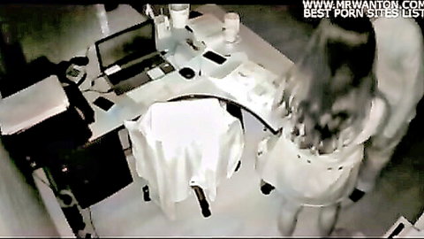 Blurry Korean IP cam voyeur of Asian woman in white dress in office