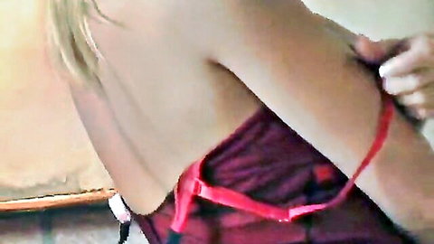 Skinny blonde babe pulls red bra strap teasing her fair back in solo lingerie foreplay