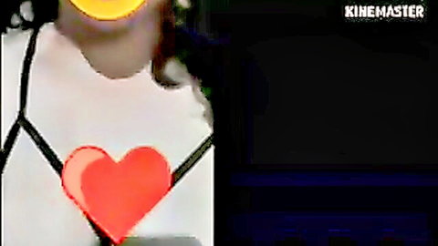 Egyptian woman in revealing white top with red heart, doctor-patient tease