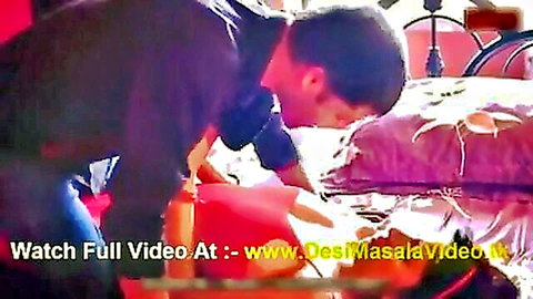Desi couple in intimate bedroom pose, Indian web series scene