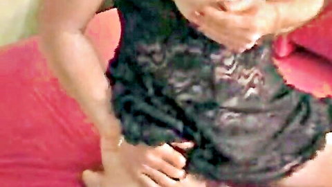 Mature BBW in black lace lingerie spreads legs fingering pussy on red bed