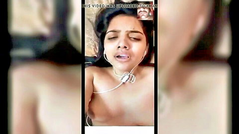 Topless Indian babe with big tits moans in ecstasy wearing headphones on webcam