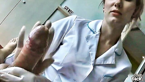 Blonde nurse in white uniform giving explicit handjob treatment