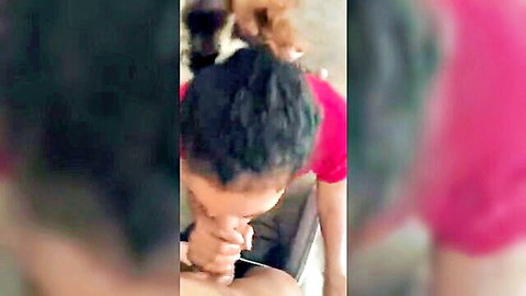 Blurry Asian amateur couple in uniforms, girlfriend giving head after school