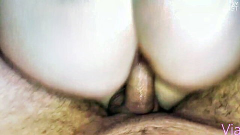 Close-up of bound white woman's exposed ass and hairy pussy in rough BDSM scene