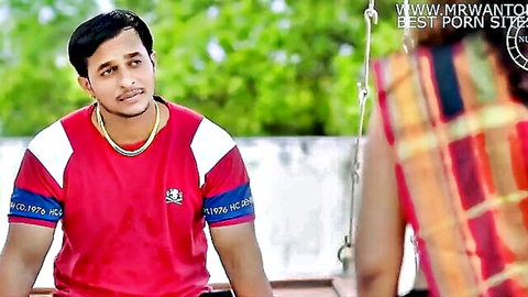 Smiling South Asian guy in red shirt and gold chain with Indian woman in colorful saree posing outdoors amateur tease