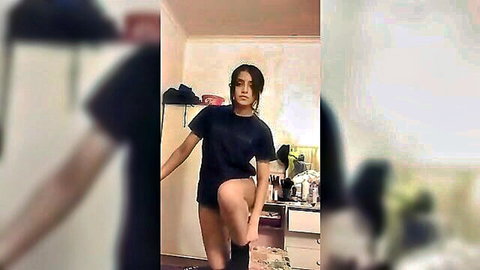 Skinny Indian teen girlfriend teases in tight black shorts lifting leg in bedroom mirror