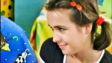 Katerina Konec smiling with pigtails in black top, cute teen vibe