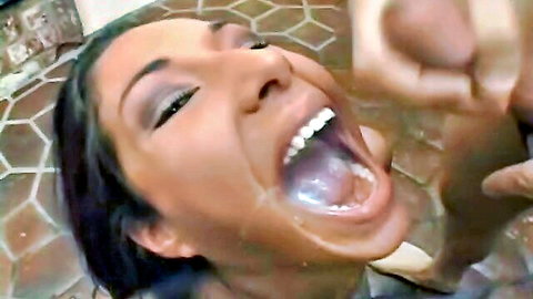 Latina beauty with mouth wide open in intense oral closeup