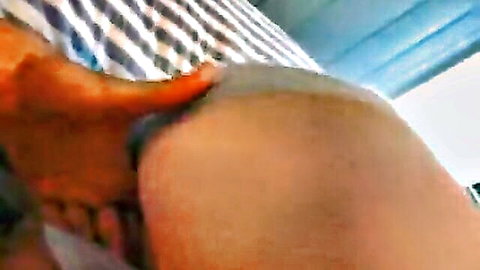 Close-up of shaved pussy being spread by hands in explicit adult scene