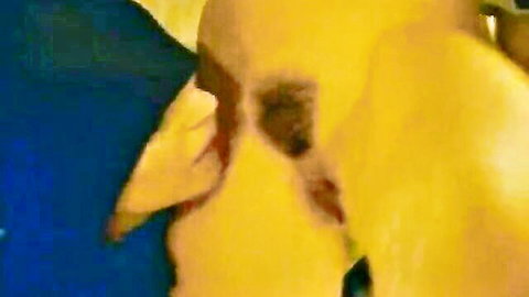 Vintage close-up of woman in blue giving oral in The Castle of Lucretia 1997