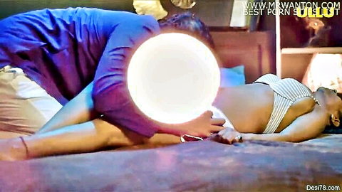 Man gropes pregnant Indian woman's exposed pussy with hand between spread legs on bed